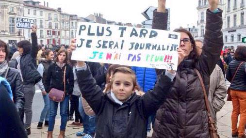 MartynMcL's tweet image. In Paris, a child's placard: "When I grow up, I'll be a journalist. I'm not afraid." #CharlieHebdo (H/T @ChrisMoos_)