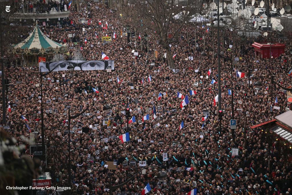 nytimes's tweet photo. Demonstrators make their way along Boulevard Voltaire during a unity march in Paris http://t.co/c0swYtRTGI http://t.co/NvL8ZPZ5mR
