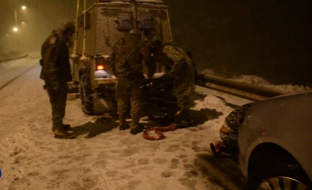 IDF's tweet photo. WATCH: #IDF forces save #Palestinian stuck in recent snow storm. http://t.co/fMgvqKOLK5 http://t.co/XllLnuObWi