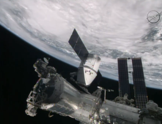NASA's tweet photo. #Dragon is just a few min away from being attached and bolted to #ISS http://t.co/ru7Sj3zQOW