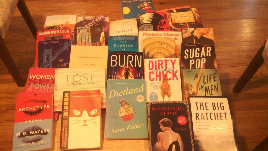 JVNLA's tweet image. More of a splat than #stacksofbooks but these are our books on our office table...and I&apos;ve read them all! You?