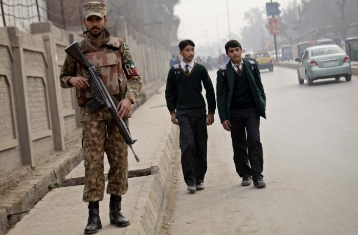 guardian's tweet photo. Pakistan school reopens after Taliban massacre – in pictures http://t.co/y7A7lcwg2s http://t.co/kx6jmgtVY5