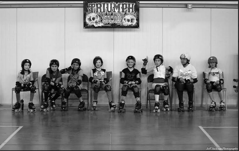 TheTriumphParty's tweet photo. Loving this picture of Skagit Valley Roller Derby looking #pumped under our mini #triumphtattoo banner #rollerderby http://t.co/8MH5b78I9B