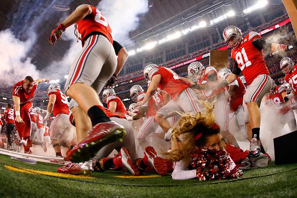 BleacherReport's tweet photo. An Ohio State cheerleader was nearly trampled as players ran onto the field http://t.co/rg7KAcQ3l9 http://t.co/wzcFH8nLVs