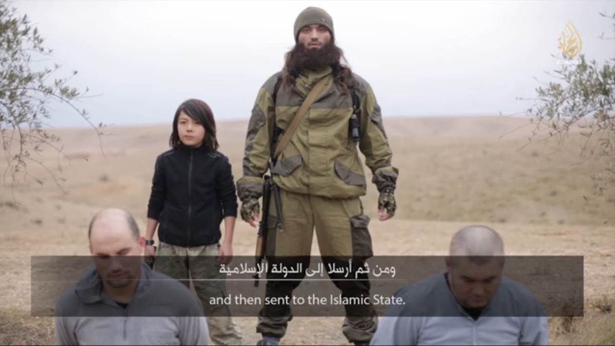 ChinaStudies's tweet photo. Kazakh child soldier executes ‘Russian spies’ in new Islamic State video, reports @reidstan. http://t.co/AlEZn4L8Uu http://t.co/yqAVfxAdYJ