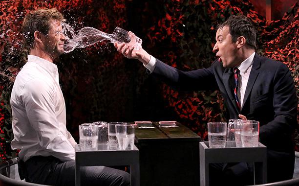 EW's tweet image. What did Jimmy Fallon do with Chris Hemsworth on @FallonTonight? Soak him in water, of course: ow.ly/HjFCE