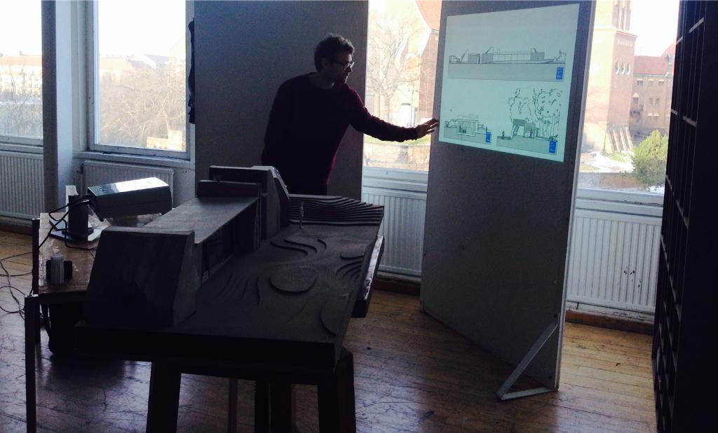 KTH_A's tweet photo. Olsson presenting the building's program, a geological centre - which include a UV-light room for glowing crystals... http://t.co/fkT2jmzgwd