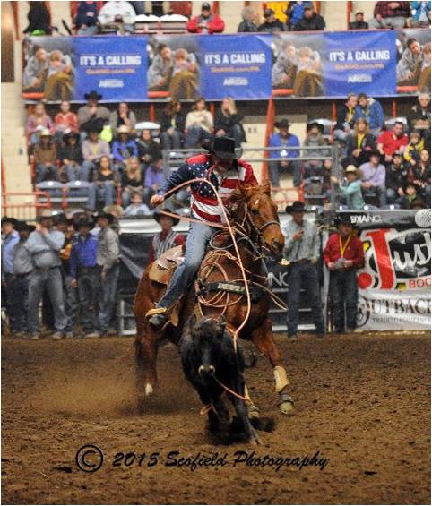 Tie down roper, Charity Rodeo announcer and First Frontier Rodeo sponsor Terry Shetron lookin' cool in this photo!