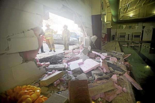 jontuleya's tweet photo. From @delcotimes photog @Kauffee_TH: the hole left behind after car crashed into the side of Ridley Area YMCA. http://t.co/KfDsFYm6yN