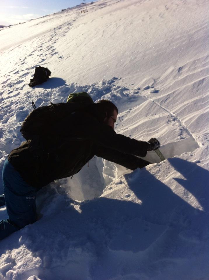 Checking the slope before a shread! Don't see many skiers doing this....