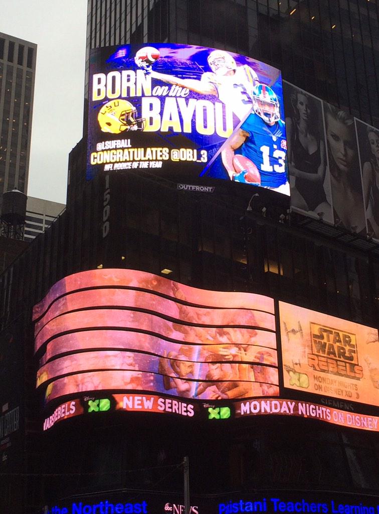 <a href="/LSUBonnette/">Michael Bonnette</a> <a href="/LSUfball/">Follow @LSUfootball</a> Photo courtesy of <a href="/Tptburkes/">Thomas Burkes</a> (LSU alum in NYC) #LSU and <a href="/OBJ_3/">hang dave gettleman</a> on the big stage, Times Square!
