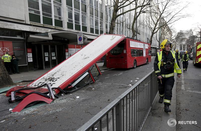 Reuters's tweet photo. PHOTOS: Double-decker bus loses its top in London. http://t.co/o8KL0legk7 http://t.co/Gsr5cD6Lln