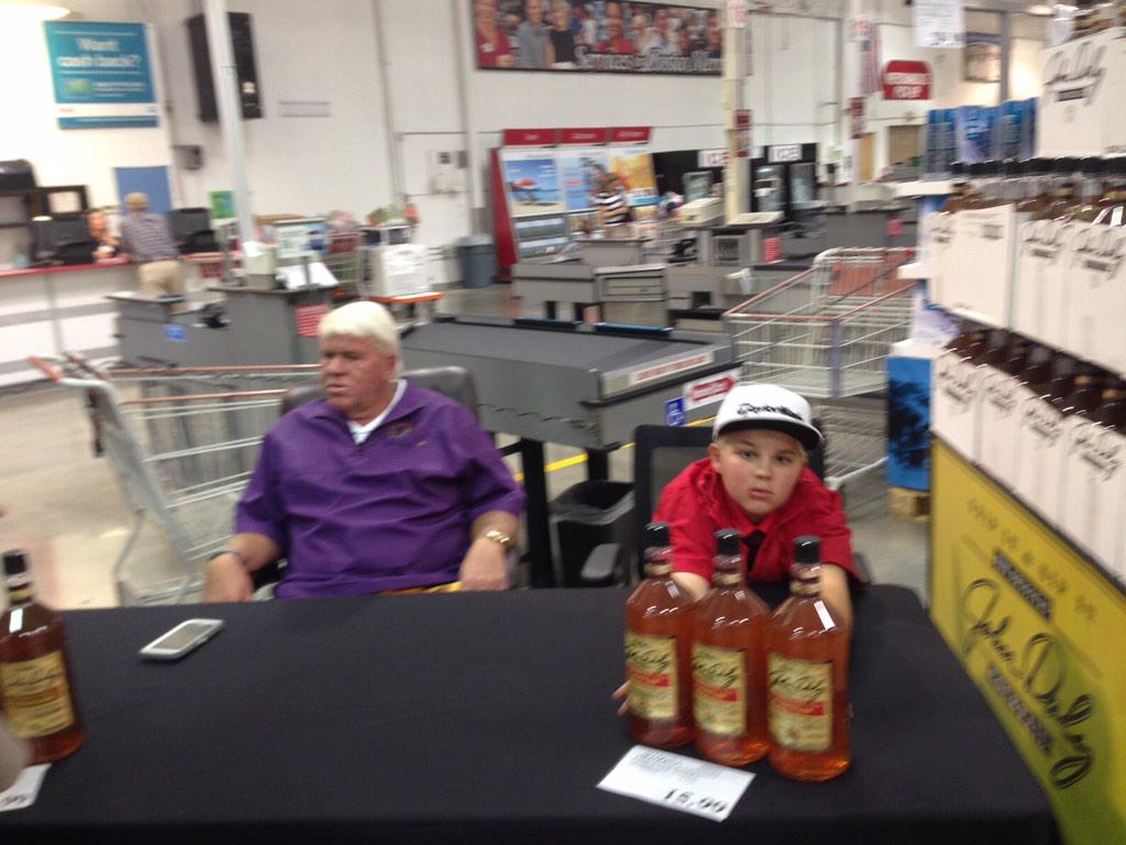 What's John Daly up to these days? Shilling booze at Costco with a child.