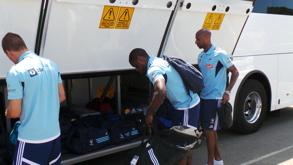 SydneyFC's tweet photo. Arnie with his @ArthurGalanAG suit leads the team as they board the bus for Gosford this afternoon! #SydneyIsSkyBlue http://t.co/1zE9uG4mZe