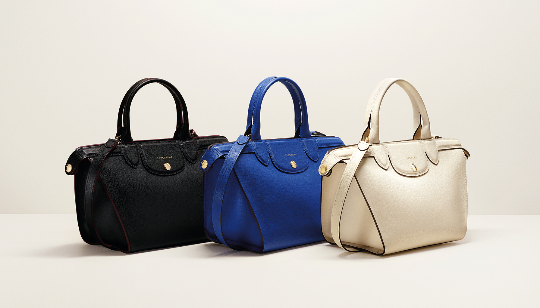 Longchamp on X Black Blue or Ecru Which mini Le Pliage Heritage bag is for you http t oG3Y3ZLKw9 X