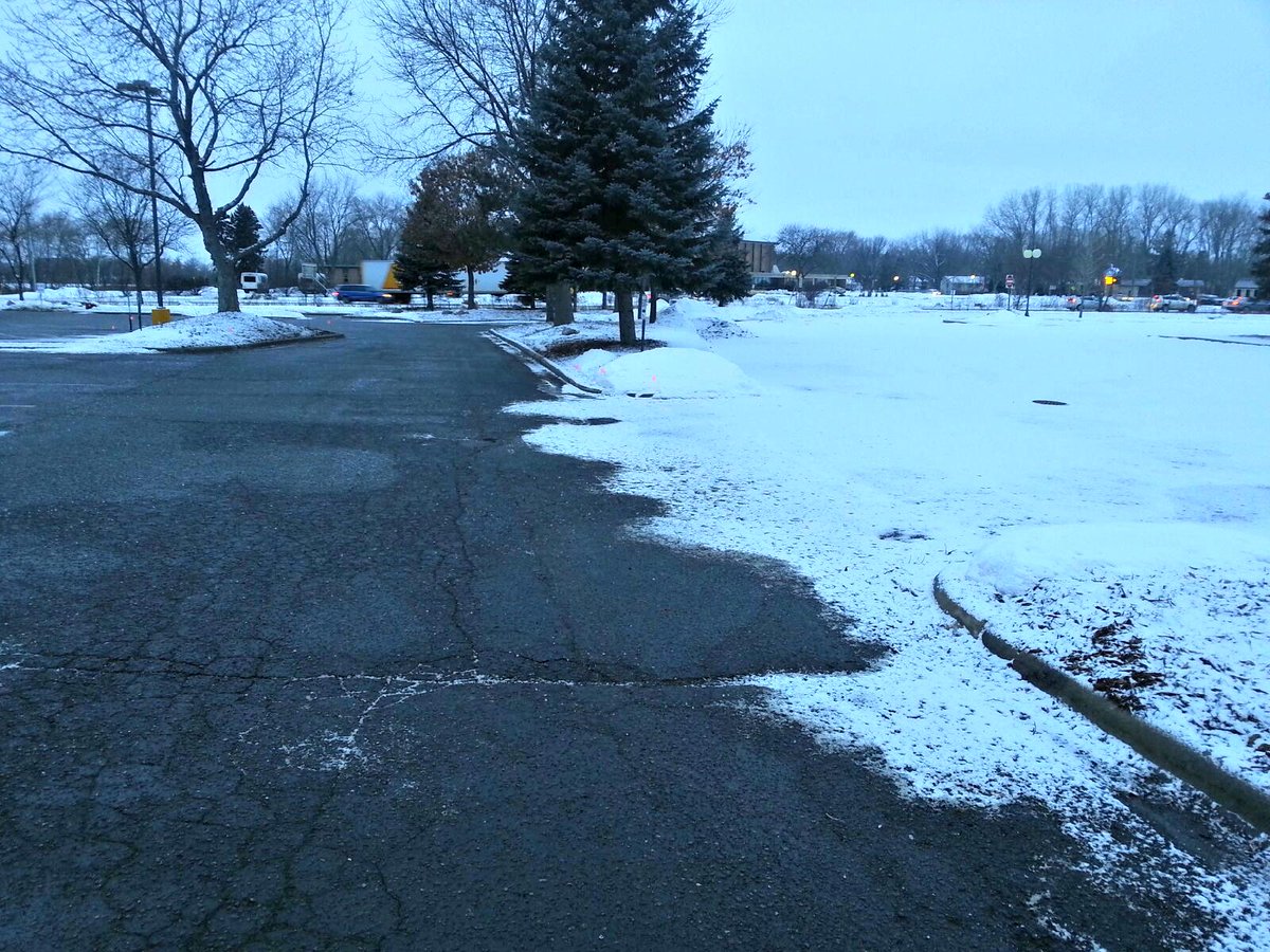KGLandscape's tweet photo. The difference between salting a parking lot and not salting a parking lot are incredible! #goodbyeice #salting http://t.co/f578gDBPc8