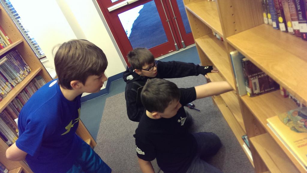 MISRiz5's tweet photo. Deciphering clues, searching the nonfiction section and looking for call numbers to crack the code! http://t.co/P2W1TumQXh