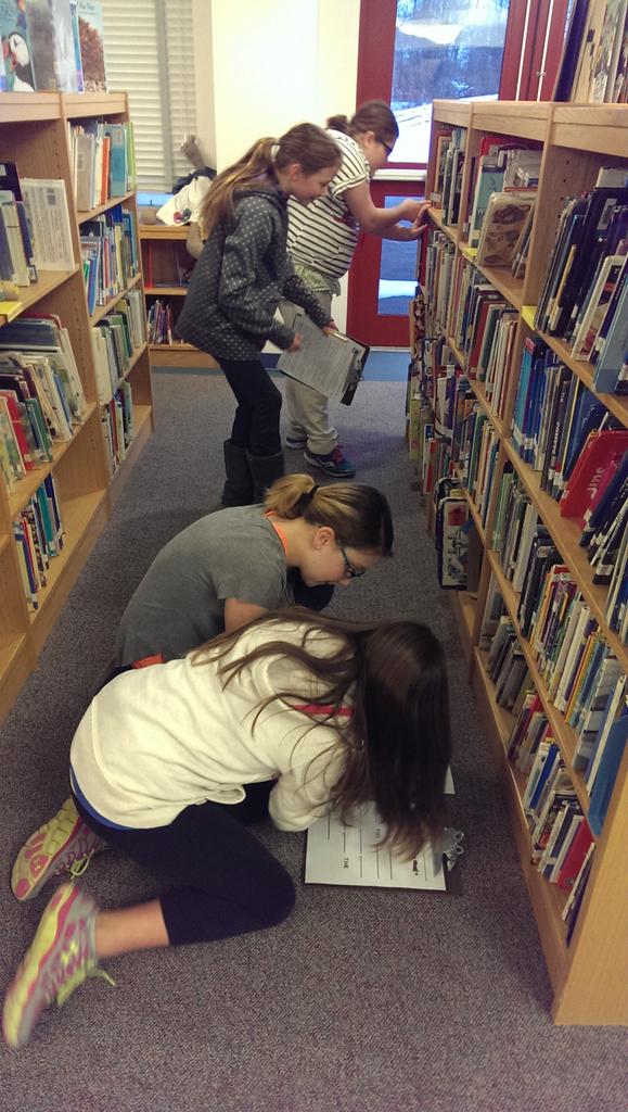 MISRiz5's tweet photo. Deciphering clues, searching the nonfiction section and looking for call numbers to crack the code! http://t.co/P2W1TumQXh