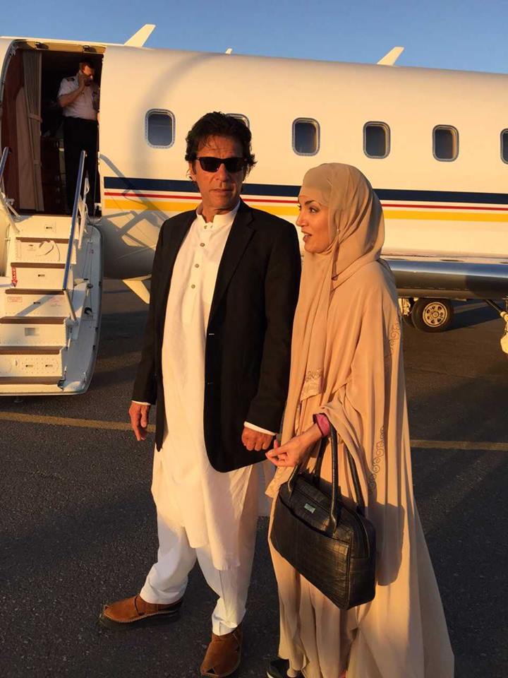 Natsecjeff's tweet photo. Imran Khan with his Sharia-compliant wife in Medina, Saudi Arabia, standing in front of his private jet. #modestyFAIL http://t.co/TPLD2EbPRD