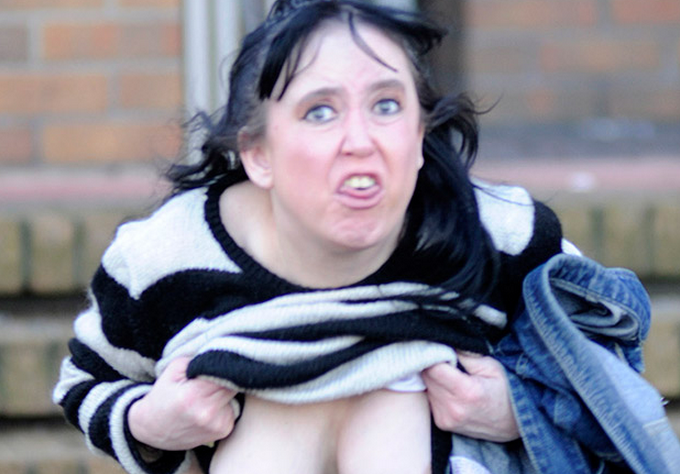 The Scottish Sun on X: Woman flashes boobs outside court — after