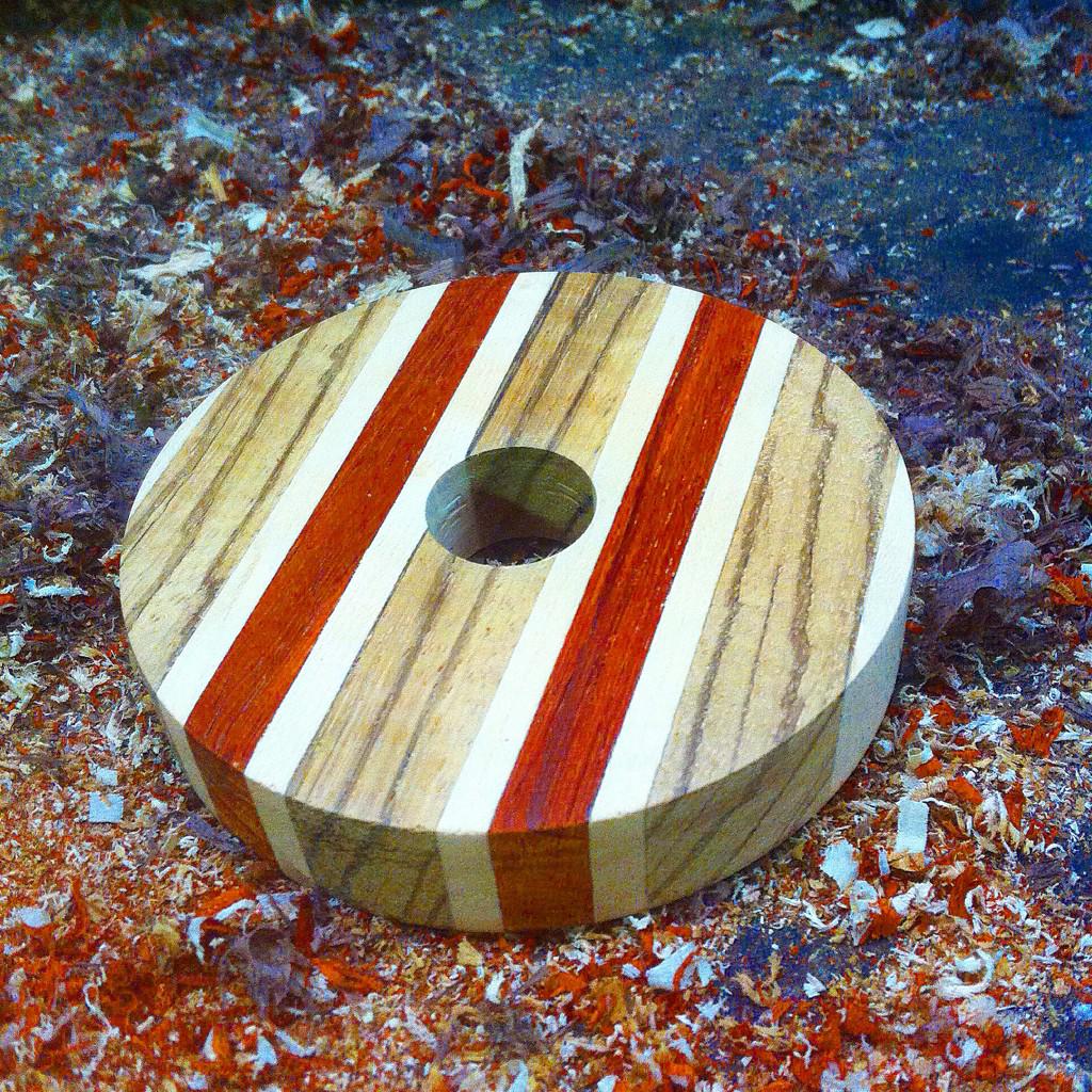 Laminated padauk, Birdseye, and zebrawood turkey call blank.