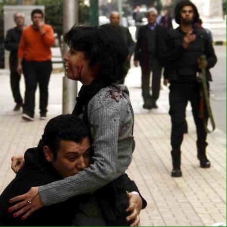 TamaraAlrifai's tweet photo. #shaimaa_sabagh trying to put flowers for those dead in #Egypt revolution, killed in cold blood http://t.co/u1BQ3JtgCY