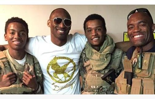 TimothyLewis_'s tweet photo. Here's Kobe wearing a flashy mocking jay shirt, I guess he's a fan of The Hunger Games...who knew? http://t.co/43Iv2QVFSW