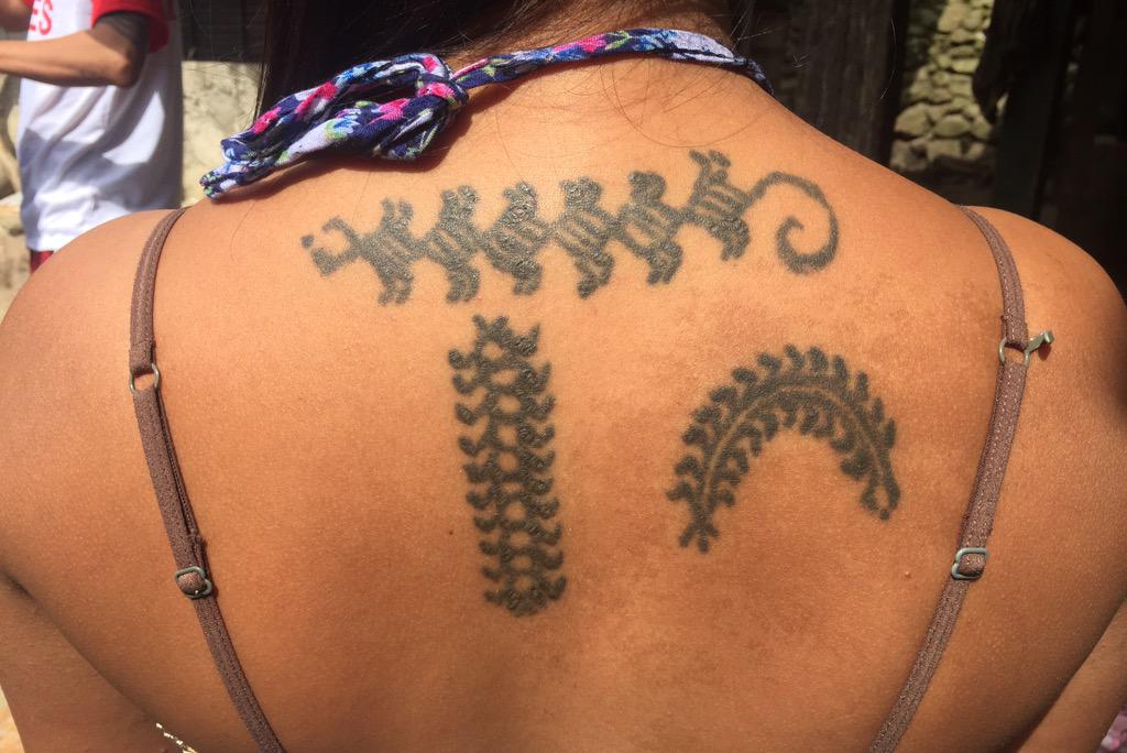 tribal centipede tattoo