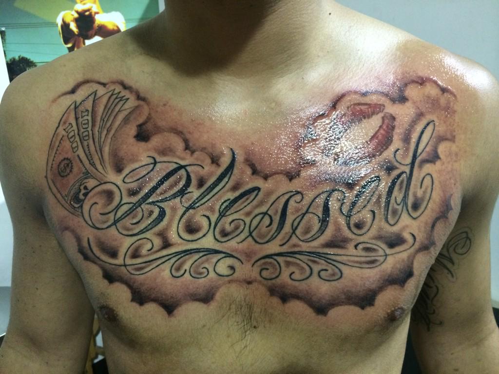 Black simple blessed tattoo on left upper chest for men