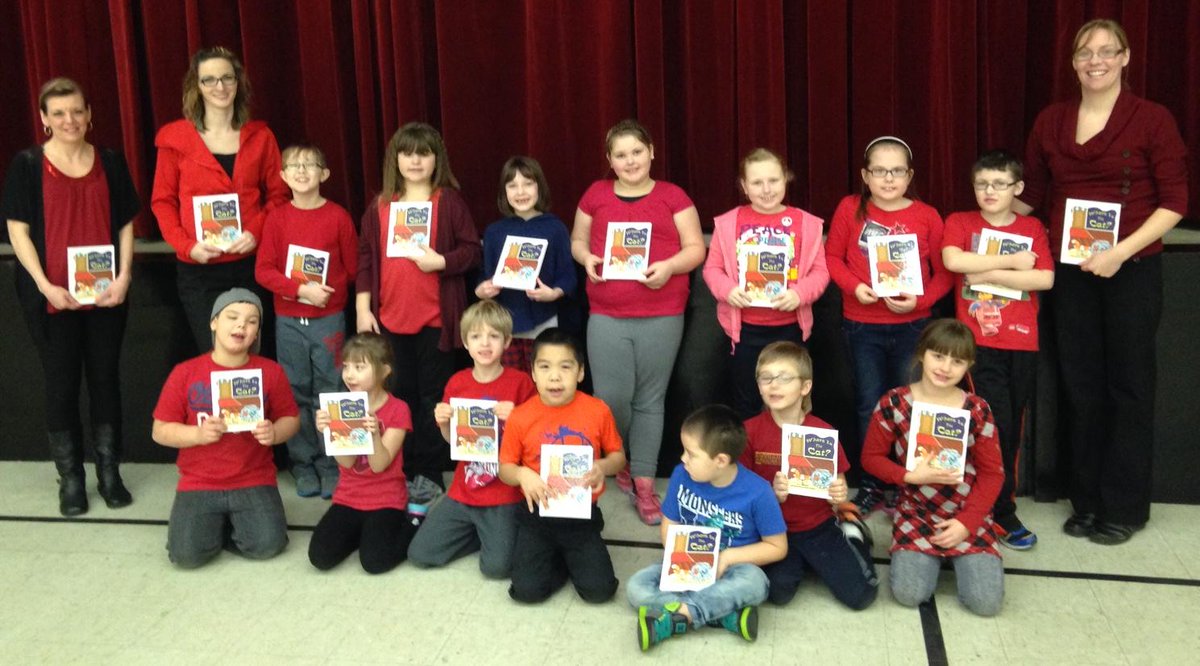 Primary students pose with their signed copy of former Englee resident Ada Gillard's book Where Is The Cat <a href="/NLESDCA/">NLESD</a>