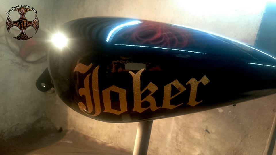 TransfigureCH's tweet photo. "After the artwork of the evil Joker on the Harley tank just completed the 24 carat gold leafing work. http://t.co/v88RTCJziu