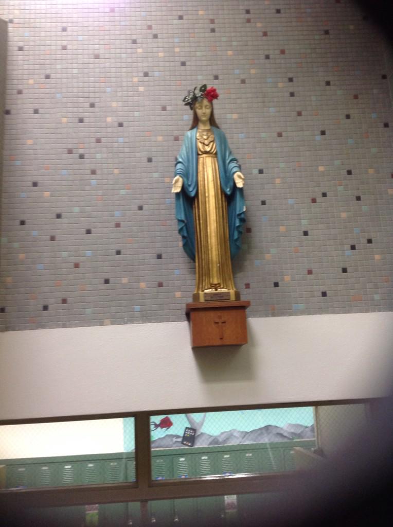 The Mary statue above the middle staircase