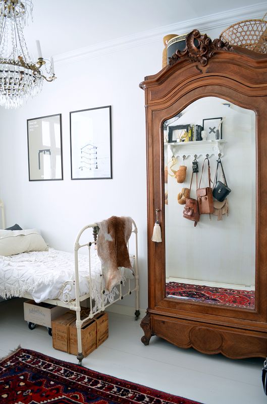 A small space does not preclude you from big style. #antiquewardrobe #chandelier #smallhouselove #TrendingTuesday