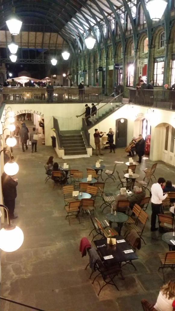 In Covent Garden watching a string quartet