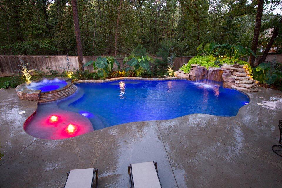 rectangle pool with tanning ledge and spa