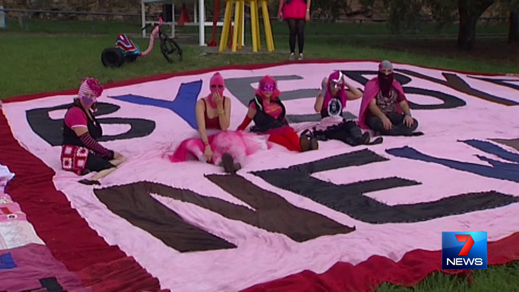 7NewsBrisbane's tweet photo. Protesters from #KnitYourRevolt
Tricycle Gang have hung a banner from #KangarooPoint cliffs, 1 day before #qldvotes. http://t.co/fvWvygVtpC
