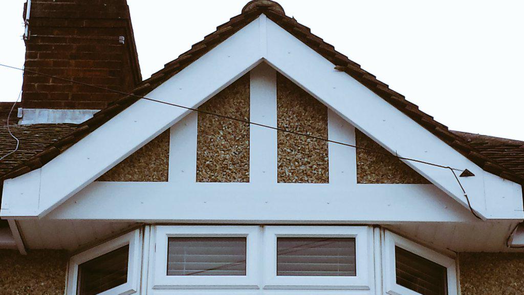 New fascia to pediment of house and pebble dashed