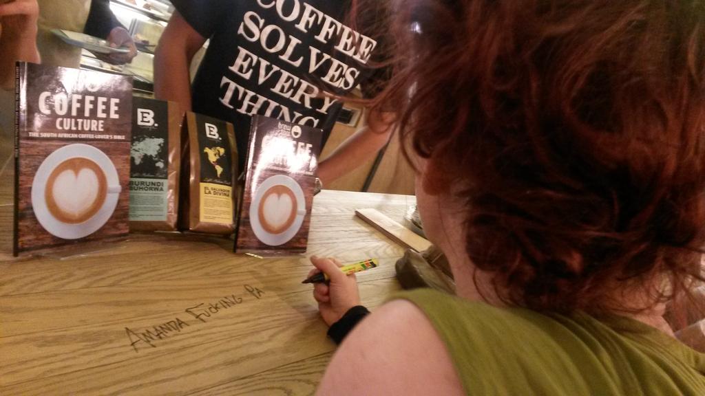 AFPinSA's tweet image. Here's @amandapalmer signing the counter at Exclusive Books' coffee shop. :)