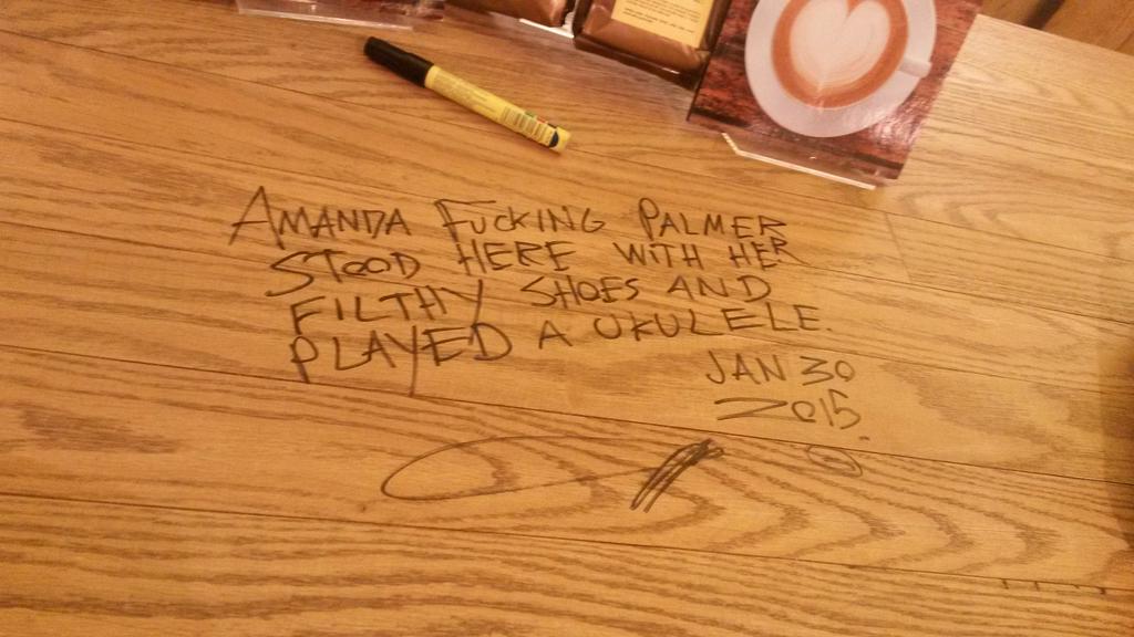 AFPinSA's tweet image. Here's @amandapalmer signing the counter at Exclusive Books' coffee shop. :)