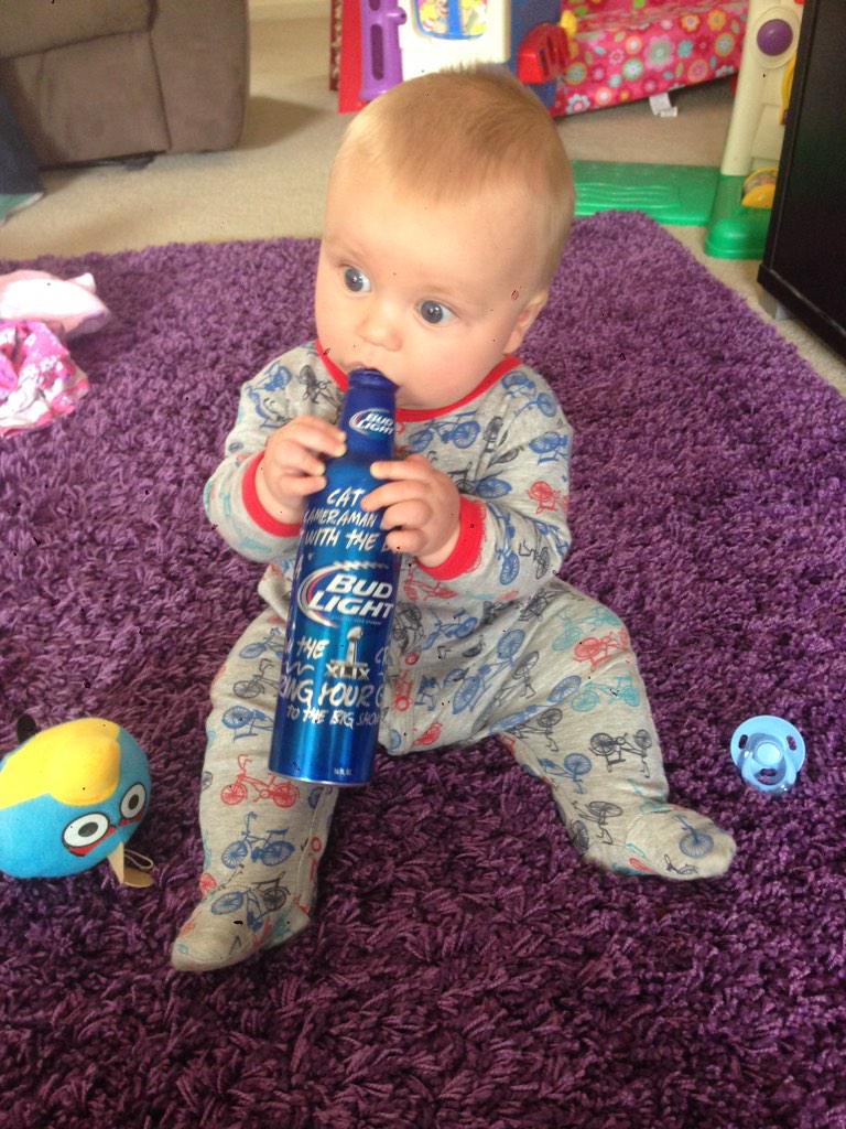 Dubaya17's tweet photo. @budlight starting my little aussie man early, he loves the aluminum bottles #bud light #SB49 http://t.co/RVRAPQbMgM