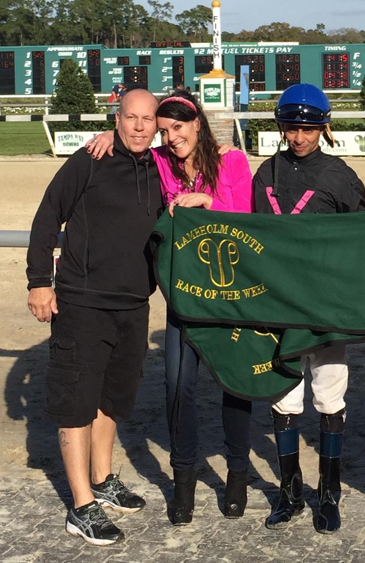 VoodoomonRacing's tweet photo. Owner Vanessa Nye being presented a winning blanket for Happy, with trainer Dale Bennett and jockey Victor Lebron. http://t.co/meLj8vN9P1
