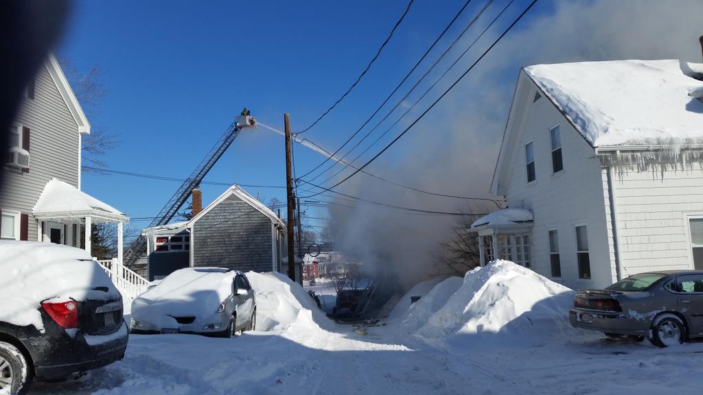 KarenTwomeyV's tweet photo. Pouring water on a burning  roof in Waltham. http://t.co/p2RFf18jtX