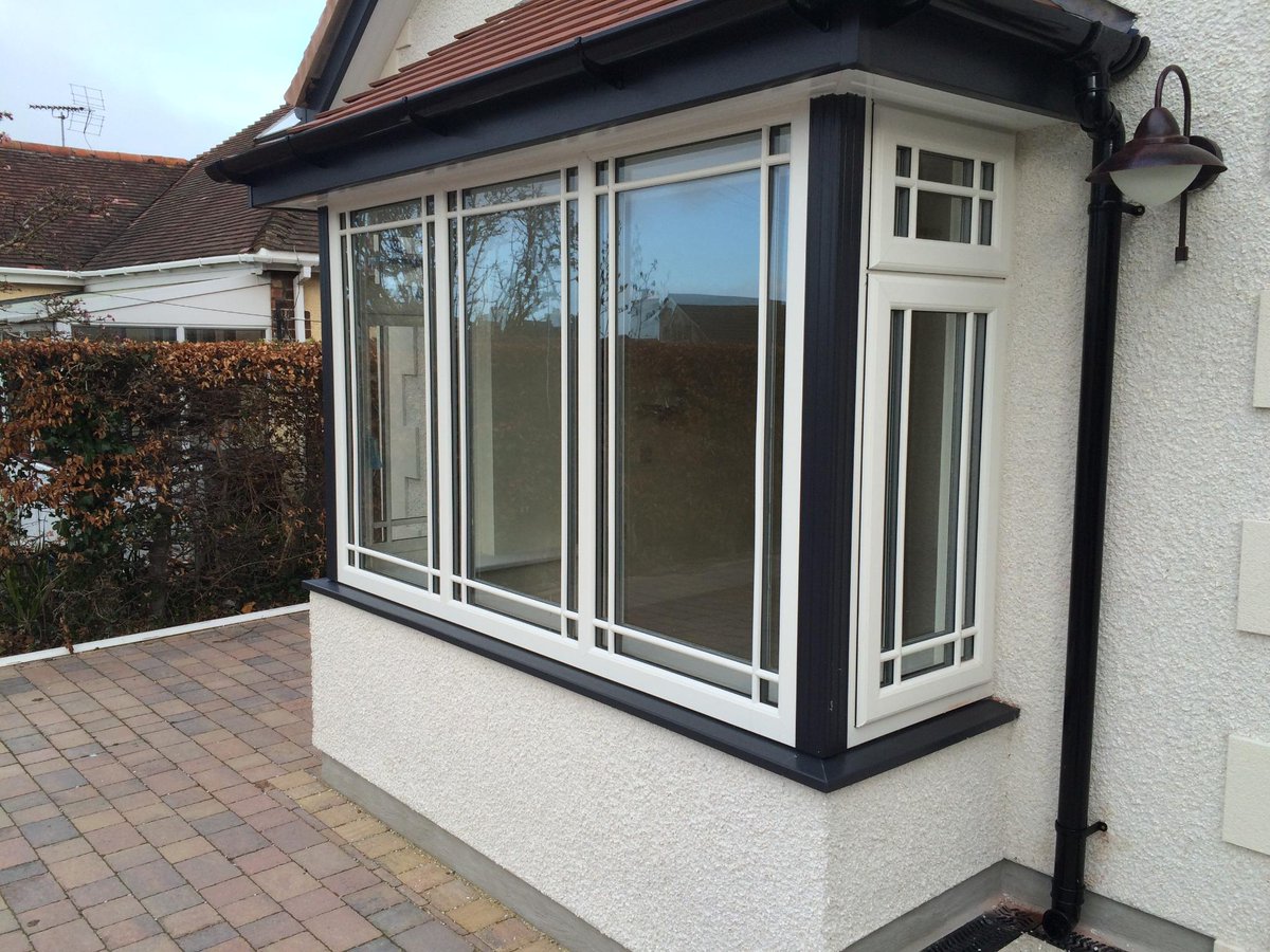 CymruWindows's tweet photo. What a cracking job! White wood grain window​ frames, Anthracite grey cills &amp; posts. @REHAUWindows @ShepleyWindows http://t.co/Yzrpl48hbv