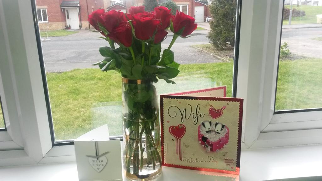 My first  "wife" Valentine's day  card.....and a dozen red roses x