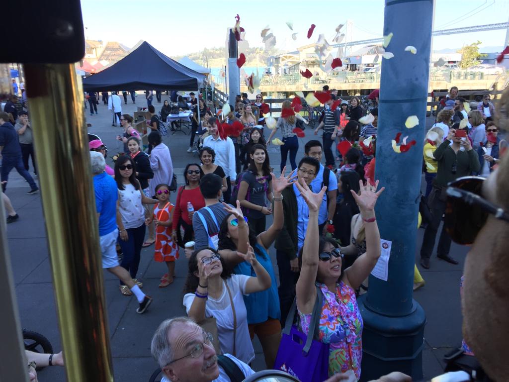 BloomThat's tweet photo. It’s raining rose petals off the #BloomTrain at the @SFFerryBuilding!!! Catch some love today! #SFLove http://t.co/nkC7j6bmur