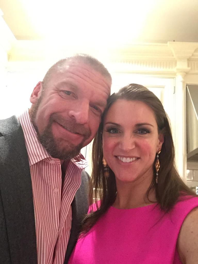 RawRuler's tweet photo. Happy Valentine's Day from myself and my darling wife, @CunningMcMahon.  Who's loving her large bouquet of flowers. http://t.co/mzS2Dw88wy