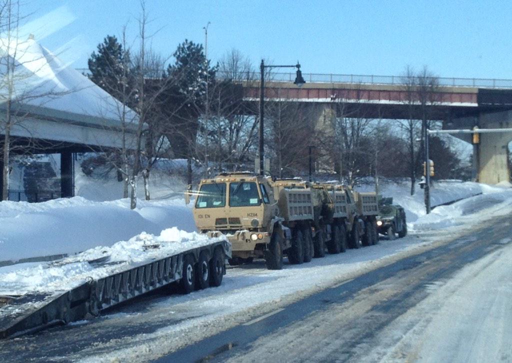 LOCAL_718's tweet image. Members of the @NationalGuard staged outside the Forest Hills @MBTA station #MAsnow #blizzardof2015