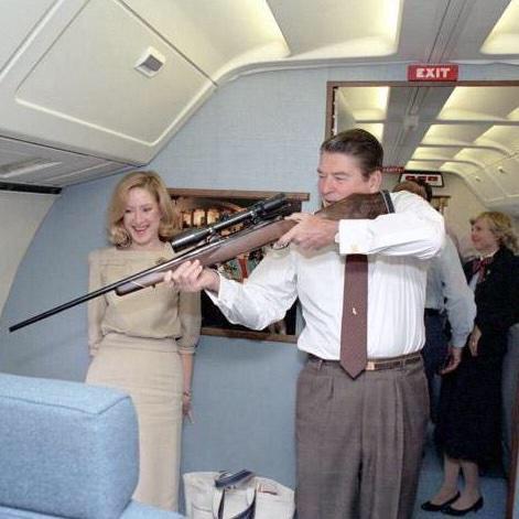 EarlDibblesJr's tweet image. Nothin' says "Merica" like Ronald Reagan with a rifle on Air Force One.
