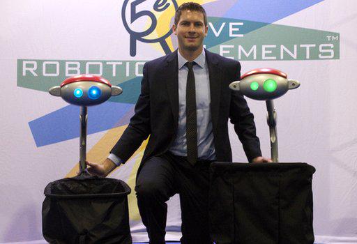 budgeebot's tweet photo. Great shot of head Robot Engineer, Nick L. with 2 #budgee at #CES2015! http://t.co/VPpvONbxiS