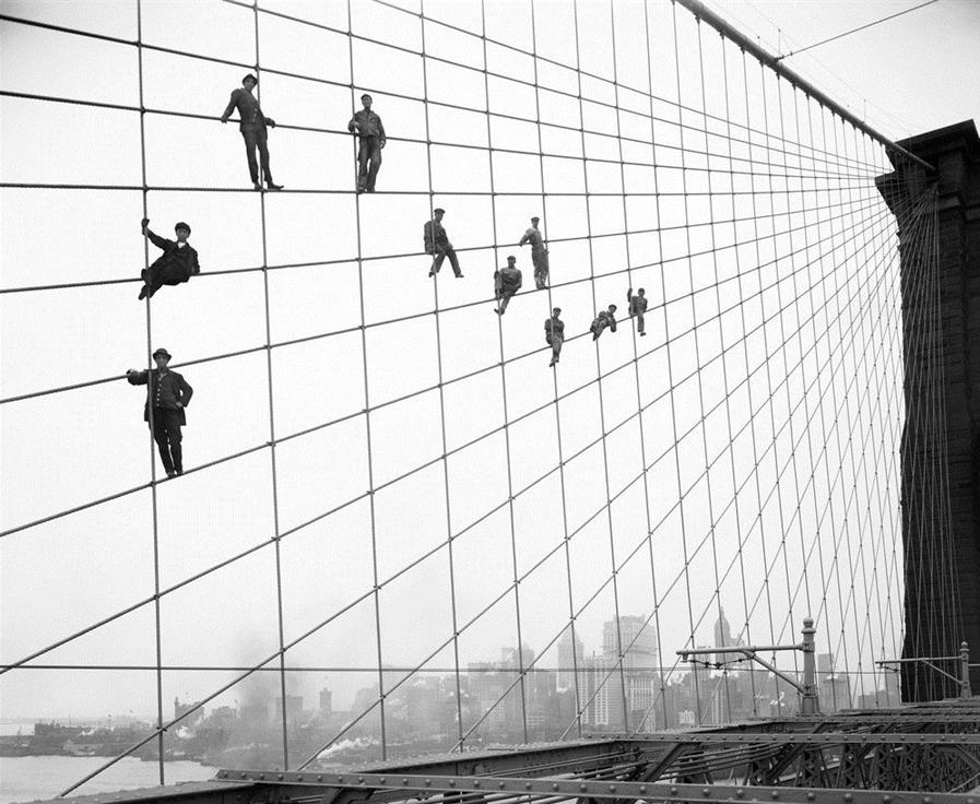 SkylineWindows's tweet photo. A bit of #fun for a #Friday. #NYC construction workers? or #FlyingWallenda stunt? #Historic #daredevil http://t.co/xTOSFaaBQM